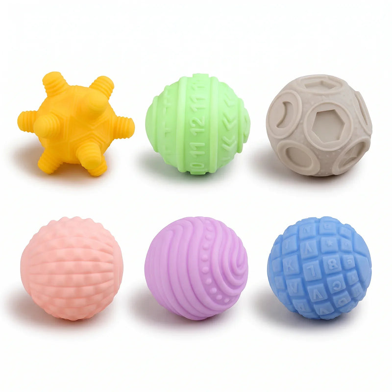 Les six balles sensorielles, coloris vifs, chacune avec sa surface