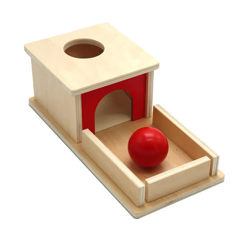 Boîte de permanence en bois : la boîte à trou, le plateau et la balle rouge
