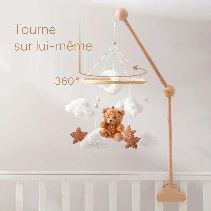 Le mobile tourne sur lui-même au bout du support